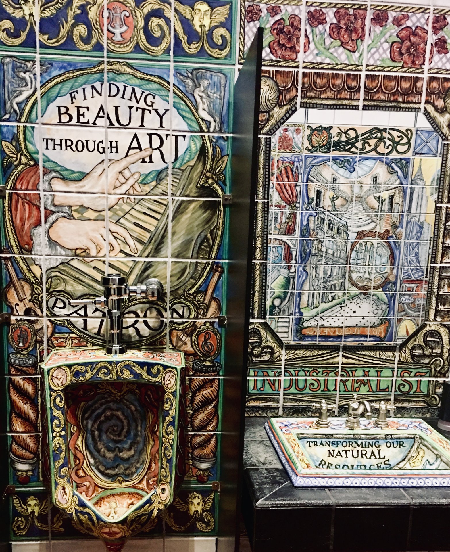 Finding beauty through art above the urinal. The adjacent sink says “Transforming our Natural resources.”